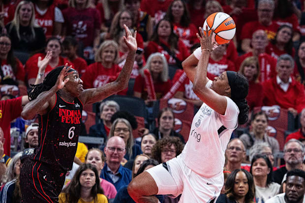 Aces forward NaLyssa Smith (3) shoots the ball while Indiana Fever forward Natasha Howard (6) defends