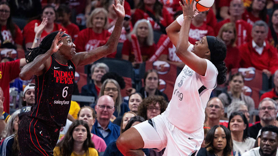Aces forward NaLyssa Smith (3) shoots the ball while Indiana Fever forward Natasha Howard (6) defends