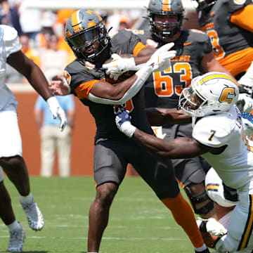 Tennessee running back Dylan Sampson (6) is tackled by Chattanooga defensive back Reuben Lowery III (7) during a game between Tennessee and Chattanooga, Saturday, Aug. 31, 2024.