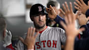 Toronto, Ontario, CAN; Boston Red Sox third baseman Alex Bregman (2) is congratulated after scoring against the Toronto Blue Jays during the ninth inning at Rogers Centre.