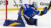 Nov 21, 2024; St. Louis, Missouri, USA;  St. Louis Blues goaltender Jordan Binnington (50) defends the net against the San Jose Sharks during the third period at Enterprise Center. Mandatory Credit: Jeff Curry-Imagn Images