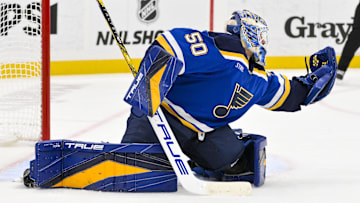 Nov 21, 2024; St. Louis, Missouri, USA;  St. Louis Blues goaltender Jordan Binnington (50) defends the net against the San Jose Sharks during the third period at Enterprise Center. Mandatory Credit: Jeff Curry-Imagn Images
