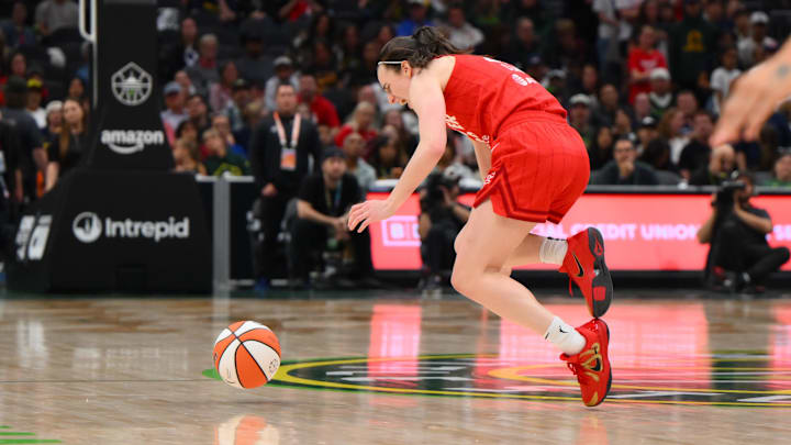 Indiana Fever guard Caitlin Clark falls down awkwardly during the second half against the Seattle Storm.