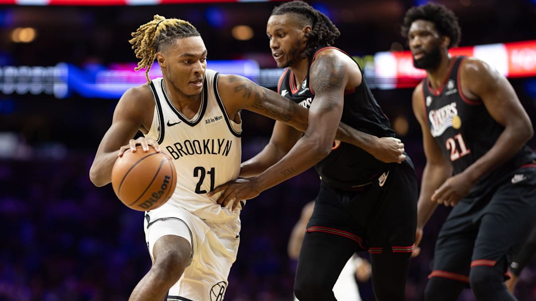 Dec 23, 2025; Philadelphia, Pennsylvania, USA; Brooklyn Nets forward Noah Clowney (21) dribbles against Philadelphia 76ers forward Jabari Walker (33) during the first quarter at Xfinity Mobile Arena. Mandatory Credit: Bill Streicher-Imagn Images