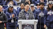 Apr 13, 2025; Hartford, CT, USA;   UConn student-athlete Azzi Fudd addresses the crowd while her teammates UConn student-athletes Paige Bueckers,  KK Arnold, Sarah Strong  and Ayanna Patterson look on during the Final Four champions victory parade and rally outside of the XL Center in Hartford, CT. Mandatory Credit: Scott Rausenberger-Imagn Images