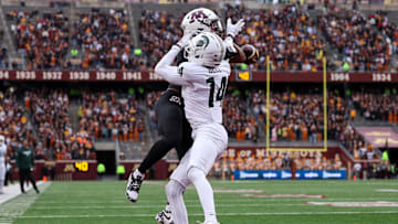 Nov 1, 2025; Minneapolis, Minnesota, USA; Michigan State Spartans defensive back Malcolm Bell (14) breaks up a pass intended for Minnesota Golden Gophers wide receiver Javon Tracy (11) during the first half at Huntington Bank Stadium. Mandatory Credit: Matt Krohn-Imagn Images