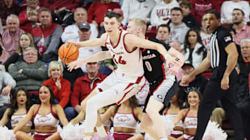 Jan 22, 2025; Fayetteville, Arkansas, USA; Georgia Bulldogs guard Blue Cain (0) is called for a reach in as he defends in the first half against Arkansas Razorbacks forward Zvonimir Ivisic (44) at Bud Walton Arena. Mandatory Credit: Nelson Chenault-Imagn Images