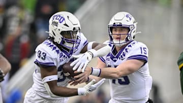 Nov 19, 2022; Waco, Texas, USA; TCU Horned Frogs quarterback Max Duggan (15) hands off to running