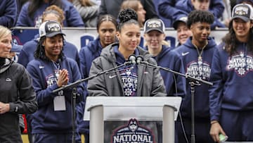 Apr 13, 2025; Hartford, CT, USA;   UConn student-athlete Azzi Fudd addresses the crowd while her teammates UConn student-athletes Paige Bueckers,  KK Arnold, Sarah Strong  and Ayanna Patterson look on during the Final Four champions victory parade and rally outside of the XL Center in Hartford, CT. Mandatory Credit: Scott Rausenberger-Imagn Images