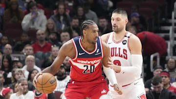 Apr 11, 2025; Chicago, Illinois, USA; Chicago Bulls center Nikola Vucevic (9) defends Washington Wizards forward Alex Sarr (20) during the first quarter at United Center. Mandatory Credit: David Banks-Imagn Images