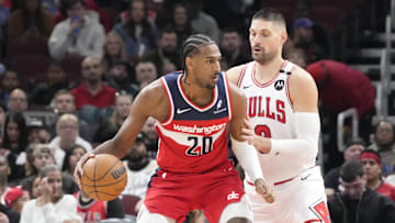 Apr 11, 2025; Chicago, Illinois, USA; Chicago Bulls center Nikola Vucevic (9) defends Washington Wizards forward Alex Sarr (20) during the first quarter at United Center. Mandatory Credit: David Banks-Imagn Images