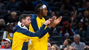 Oct 17, 2024; Indianapolis, Indiana, USA; Indiana Pacers guard T.J. McConnell (9) and center Myles Turner (33) cheer from the bench  in the second half against the Charlotte Hornets at Gainbridge Fieldhouse. Mandatory Credit: Trevor Ruszkowski-Imagn Images