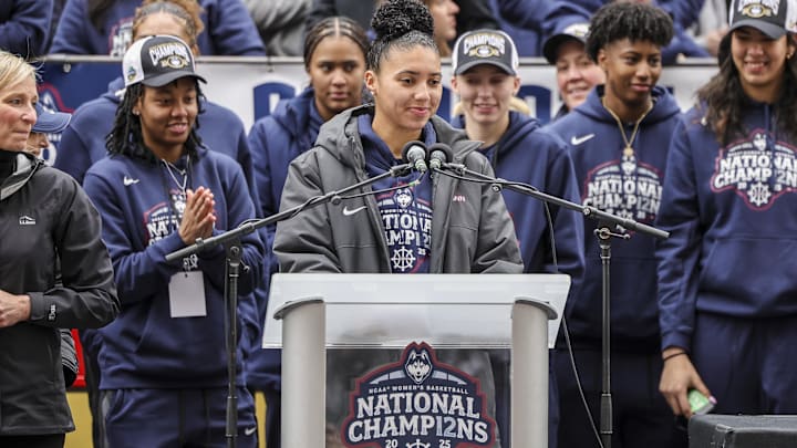 Apr 13, 2025; Hartford, CT, USA; UConn student-athlete Azzi Fudd addresses the crowd while her teammates UConn student-athletes Paige Bueckers, KK Arnold, Sarah Strong and Ayanna Patterson look on during the Final Four champions victory parade and rally outside of the XL Center in Hartford, CT. Apr 13, 2025; Hartford, CT, USA; UConn student-athlete Azzi Fudd addresses the crowd while her teammates UConn student-athletes Paige Bueckers, KK Arnold, Sarah Strong and Ayanna Patterson look on during the Final Four champions victory parade and rally outside of the XL Center in Hartford, CT.