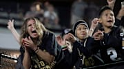 Antoinette Padilla, mother of Vanderbilt quarterback Diego Pavia, celebrates after he scored a touchdown against Kentucky during the third quarter at FirstBank Stadium in Nashville, Tenn., Saturday, Nov. 22, 2025.