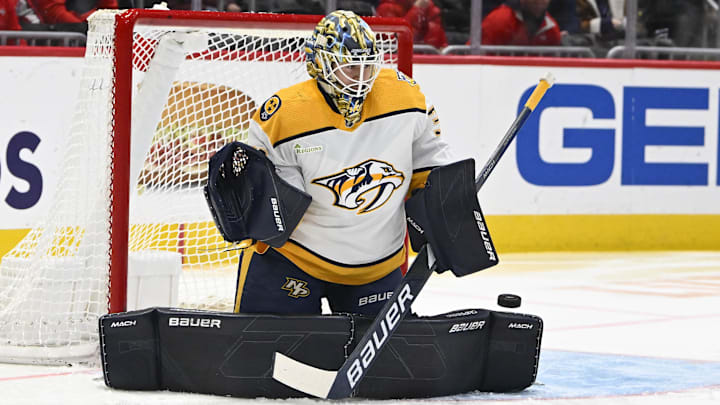 Dec 30, 2023; Washington, District of Columbia, USA; Nashville Predators goaltender Yaroslav Askarov (30) makes a save against the Washington Capitals during the first period at Capital One Arena. Mandatory Credit: Brad Mills-Imagn Images