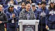 Apr 13, 2025; Hartford, CT, USA;   UConn student-athlete Azzi Fudd addresses the crowd while her teammates UConn student-athletes Paige Bueckers,  KK Arnold, Sarah Strong  and Ayanna Patterson look on during the Final Four champions victory parade and rally outside of the XL Center in Hartford, CT.