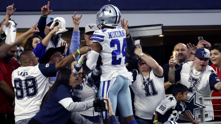 Dec 11, 2022; Arlington, Texas, USA;  Dallas Cowboys safety Israel Mukuamu (24) celebrates with fans after making an interception during the fourth quarter against the Houston Texans at AT&T Stadium.