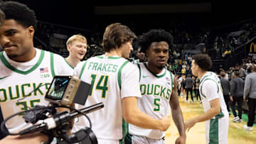 Players celebrate Oregon guard Takai Simpkins after the game as the Oregon Ducks host the Hawaii Rainbow Warriors on Nov. 4, 2025, at Matthew Knight Arena in Eugene, Oregon.