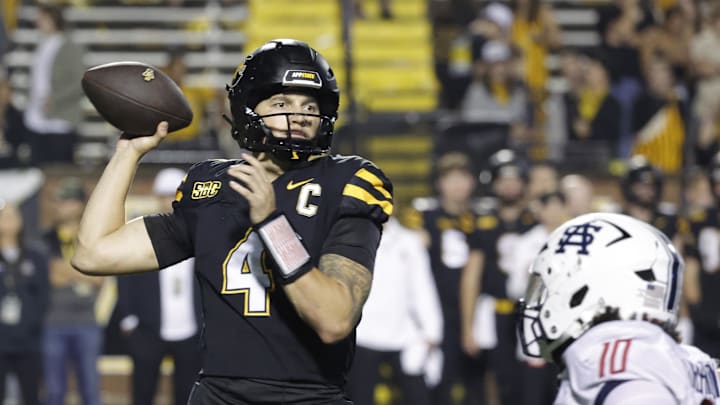 Sep 19, 2024; Boone, North Carolina, USA;  Appalachian State Mountaineers quarterback Joey Aguilar (4) throws a pass over South Alabama Jaguars linebacker Aakil Washington (10) during the second half at Kidd Brewer Stadium. Mandatory Credit: Reinhold Matay-Imagn Images