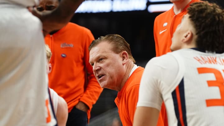 Mar 23, 2024; Omaha, NE, USA; Illinois Fighting Illini head coach Brad Underwood leads a team huddle during the second half against the Duquesne Dukes in the second round of the 2024 NCAA Tournament at CHI Health Center Omaha. Mandatory Credit: Dylan Widger-USA TODAY Sports