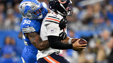 Sep 14, 2025; Detroit, Michigan, USA; Detroit Lions safety Brian Branch (32) sacks Chicago Bears quarterback Caleb Williams (18) during the fourth quarter of the game at Ford Field. Mandatory Credit: Lon Horwedel-Imagn Images