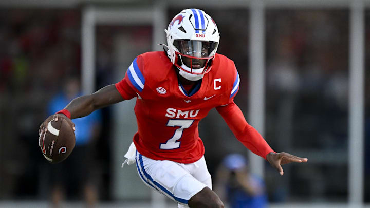 Sep 6, 2024; Dallas, Texas, USA; Southern Methodist Mustangs quarterback Kevin Jennings (7) in action during the game between the Southern Methodist Mustangs and the Brigham Young Cougars at Gerald J. Ford Stadium. Mandatory Credit: Jerome Miron-Imagn Images