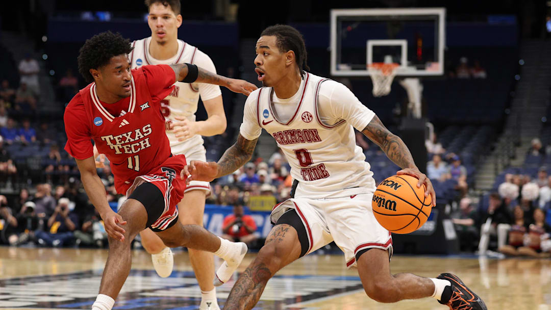 Mar 22, 2026; Tampa, FL, USA; Alabama Crimson Tide guard Labaron Philon (0) dribbles the ball against Texas Tech Red Raiders guard Jaylen Petty (11) in the second half during a second round game of the men's 2026 NCAA Tournament at Benchmark International Arena. Mandatory Credit: Nathan Ray Seebeck-Imagn Images