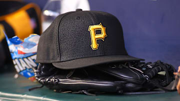 Sep 8, 2023; Atlanta, Georgia, USA; A detailed view of a Pittsburgh Pirates hat and glove before a game against the Pittsburgh Pirates in the first inning at Truist Park. Mandatory Credit: Brett Davis-Imagn Images