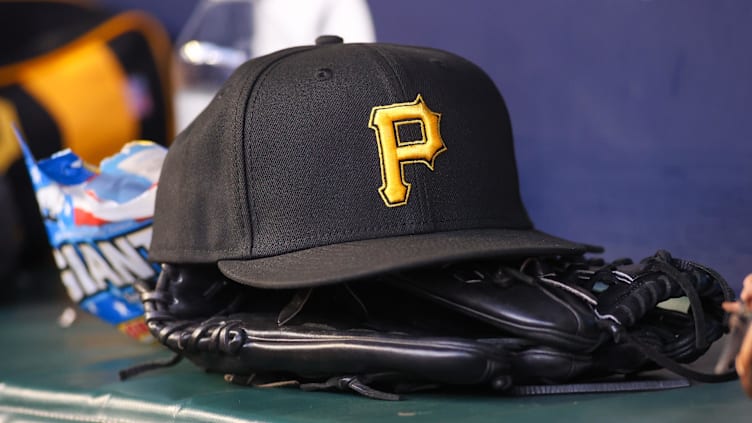 Sep 8, 2023; Atlanta, Georgia, USA; A detailed view of a Pittsburgh Pirates hat and glove before a