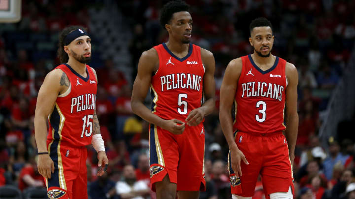 Apr 22, 2022; New Orleans, Louisiana, USA; New Orleans Pelicans guard Jose Alvarado (15) and forward Herbert Jones (5) and guard CJ McCollum (3) in the second half of game three of the first round for the 2022 NBA playoffs at the Smoothie King Center against the Phoenix Suns. The Suns won, 114-111.