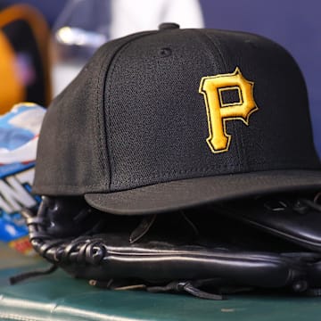 Sep 8, 2023; Atlanta, Georgia, USA; A detailed view of a Pittsburgh Pirates hat and glove before a game against the Pittsburgh Pirates in the first inning at Truist Park. Mandatory Credit: Brett Davis-Imagn Images