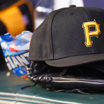 Sep 8, 2023; Atlanta, Georgia, USA; A detailed view of a Pittsburgh Pirates hat and glove before a game against the Pittsburgh Pirates in the first inning at Truist Park. Mandatory Credit: Brett Davis-Imagn Images