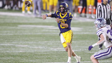 Oct 19, 2024; Morgantown, West Virginia, USA; West Virginia Mountaineers quarterback Garrett Greene (6) throws during the second quarter against the Kansas State Wildcats at Mountaineer Field at Milan Puskar Stadium. Mandatory Credit: Ben Queen-Imagn Images