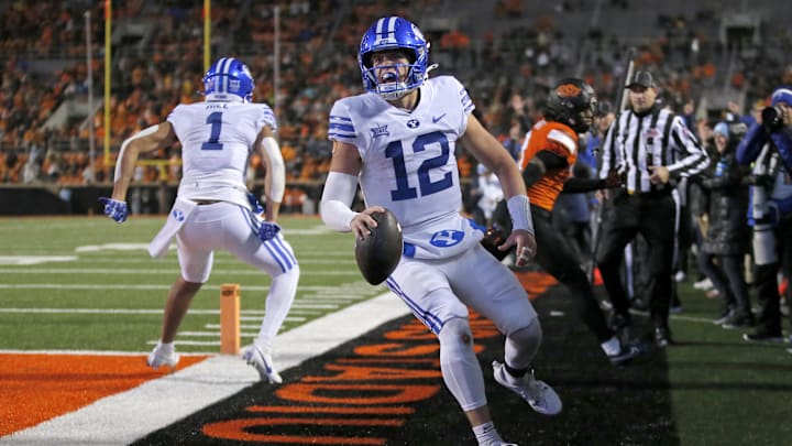 Nov 25, 2023; Stillwater, Oklahoma, USA; BYU's Jake Retzlaff (12) celebrates after scoring a touchdown in the first over time against the Oklahoma State University Cowboys at Boone Pickens Stadium.