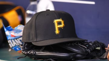 Sep 8, 2023; Atlanta, Georgia, USA; A detailed view of a Pittsburgh Pirates hat and glove before a game against the Pittsburgh Pirates in the first inning at Truist Park. Mandatory Credit: Brett Davis-USA TODAY Sports