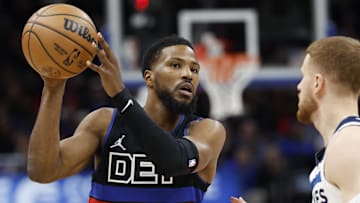Jan 4, 2025; Detroit, Michigan, USA;  Detroit Pistons guard Malik Beasley (5) is defended by Minnesota Timberwolves guard Donte DiVincenzo (0) in the first half at Little Caesars Arena. Mandatory Credit: Rick Osentoski-Imagn Images
