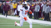 Nov 21, 2015; Minneapolis, MN, USA; Illinois Fighting Illini wide receiver Malik Turner (11) rushes with the ball after making a catch in the first half against the Illinois Fighting Illini at TCF Bank Stadium. Mandatory Credit: Jesse Johnson-Imagn Images