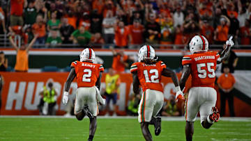 Nov 11, 2017; Miami Gardens, FL, USA; Miami Hurricanes defensive back Trajan Bandy (2) runs the ball after intercepting a pass from Notre Dame Fighting Irish quarterback Ian Book (12, not pictured) during the first half at Hard Rock Stadium. Mandatory Credit: Jasen Vinlove-Imagn Images