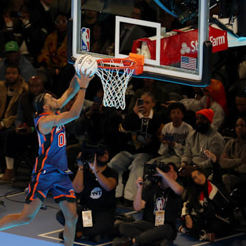 Feb 17, 2024; Indianapolis, IN, USA; New York Knicks forward Jacob Toppin (3) competes in the AT&T Slam Dunk Contest during NBA All Star Saturday Night at Lucas Oil Stadium. Mandatory Credit: Trevor Ruszkowski-Imagn Images