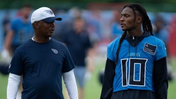 Tennessee Titans Wide Receivers Coach Tyke Tolbert and DeAndre Hopkins (10) talk after practice on the second day of training camp Thursday, July 25, 2024