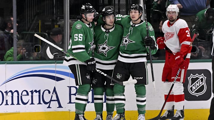 Jan 19, 2025; Dallas, Texas, USA; Dallas Stars defenseman Thomas Harley (55) and center Wyatt Johnston (53) and left wing Jason Robertson (21) celebrates a goal scored by Johnston against the Detroit Red Wings during the third period at the American Airlines Center. Mandatory Credit: Jerome Miron-Imagn Images