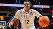 Florida State Seminoles forward Malique Ewin (12) drives the ball to the basket. The Florida State Seminoles defeated the Southern Methodist Mustangs 76-69 on Saturday, March 8, 2025.