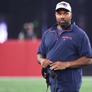 Aug 15, 2024; Foxborough, MA, USA; New England Patriots head coach Jerod Mayo walks out to check on an injured player during the second half against the Philadelphia Eagles at Gillette Stadium.