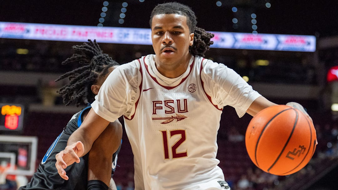 Florida State Seminoles forward Malique Ewin (12) drives the ball to the basket. The Florida State Seminoles defeated the Southern Methodist Mustangs 76-69 on Saturday, March 8, 2025.