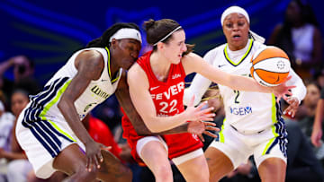 Jul 17, 2024; Arlington, Texas, USA;  Dallas Wings forward Natasha Howard (6) and Dallas Wings guard Odyssey Sims (2) battle for a loose ball with Indiana Fever guard Caitlin Clark (22) during the first half at College Park Center. Mandatory Credit: Kevin Jairaj-Imagn Images