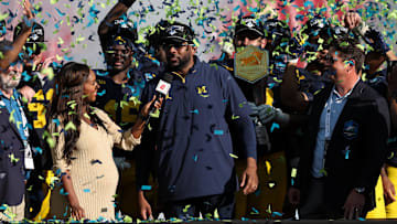 Dec 31, 2024; Tampa, FL, USA; Michigan Wolverines head coach Sherrone Moore celebrates after beating the Alabama Crimson Tide in the ReliaQuest Bowl at Raymond James Stadium. Mandatory Credit: Nathan Ray Seebeck-Imagn Images