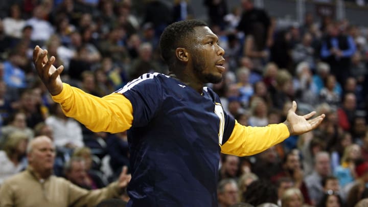 Ex-Husky  guard Nate Robinson reacts to a call in in Denver.