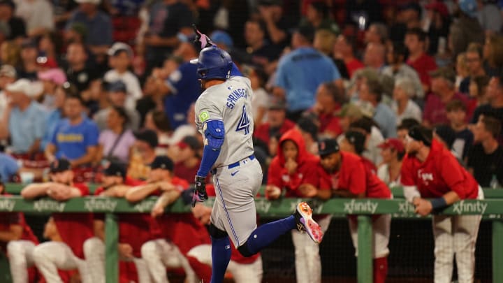 Aug 26, 2024; Boston, Massachusetts, USA; Toronto Blue Jays right fielder George Springer (4) hits a three run home run against the Boston Red Sox in the fifth inning at Fenway Park. Mandatory Credit: David Butler II-USA TODAY Sports