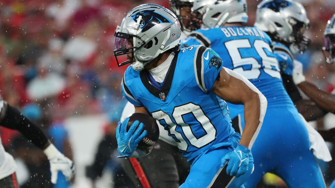 Dec 3, 2023; Tampa, Florida, USA; Carolina Panthers running back Chuba Hubbard (30) runs with the ball against the Tampa Bay Buccaneers during the first half at Raymond James Stadium. Mandatory Credit: Kim Klement Neitzel-USA TODAY Sports