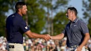 Bryson DeChambeau and Rory McIlroy shake hands on the 18th hole at the Masters. 